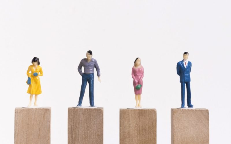 business-man-woman-sitting-equal-pieces-wooden